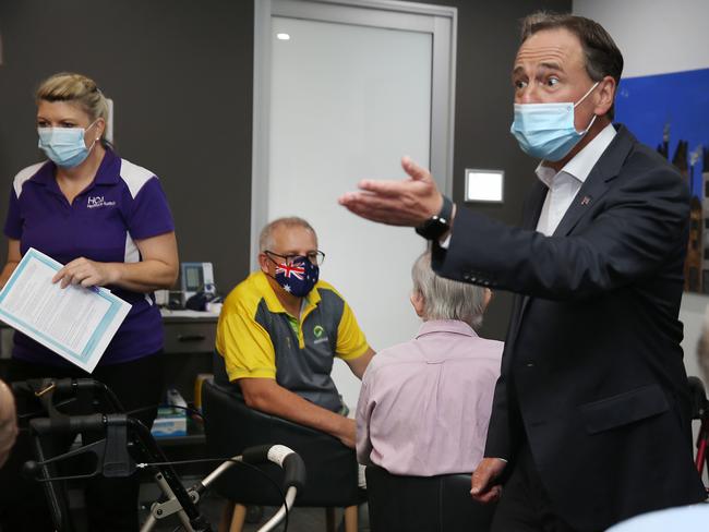 Greg Hunt with Scott Morrison with other vaccine recipients on Sunday. Picture: Jane Dempster.