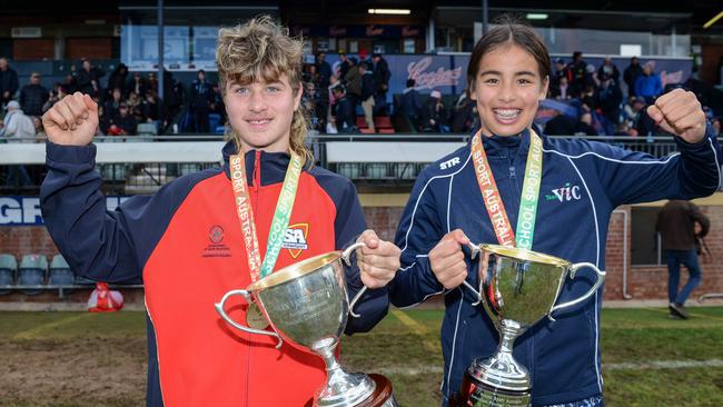 SA boys captain Harrison Webb and Victorian girls captain Isabelle Le with the winners trophies after the School Sport Australia U12 Australian Football Championships. Picture: Brenton Edwards