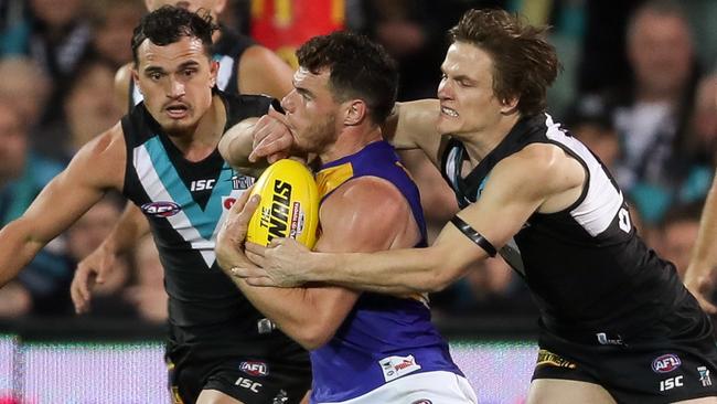 Luke Shuey of the Eagles is tackled by Jared Polec of the Power.