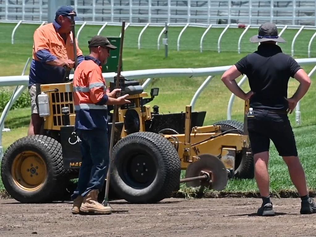 Workers removing the poisoned section of track at the Gold Coast Turf Club. Picture Supplied