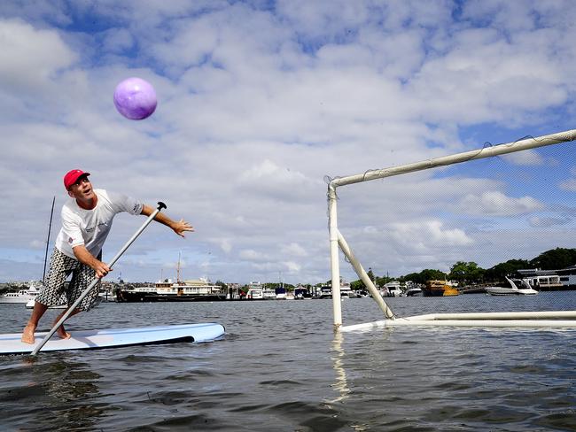 Lance O'Connor playing Stand Up paddle Board Soccer in Rose Bay. Picture: John Appleyard.