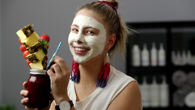 Alex Ross has a face mask, and fruit smoothie, at Skin Gym in Goodwood. Picture: Calum Robertson