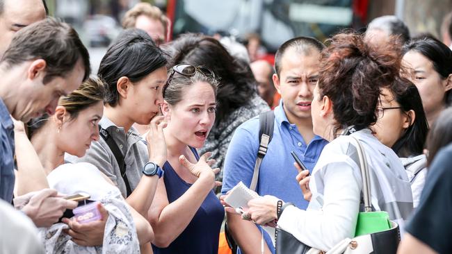 Residents wait to gain access back to the building. Picture: Tim Carrafa