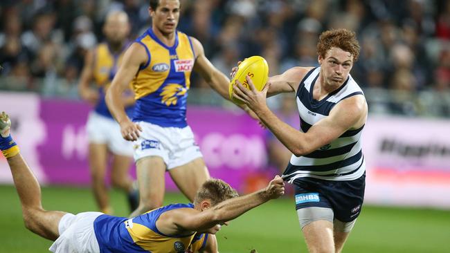 AFL Round 6. 28/04/2019. Geelong v West Coast at GMHBA Stadium. Geelongs Gary Rohan breaks from the West Coast's Brad Sheppard tackle. Pic: Michael Klein.