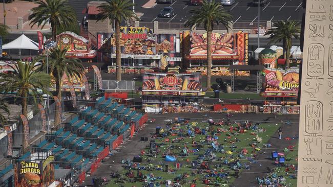 Aftermath: Personal belongings are gathered on the ground at the venue of the Route 91 Harvest Festival venue where FBI investigators continue work in the aftermath of the worst modern mass murder in US history. Picture: AFP