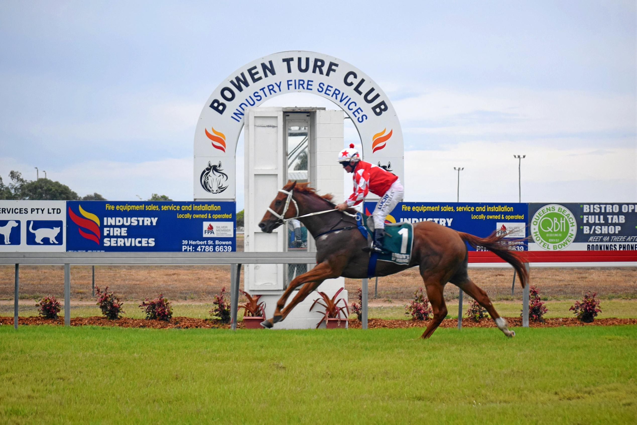 Hometown hero Lokum powers to victory with jockey Peter Cullen in the Bowen Cup. Picture: CLAUDIA ALP