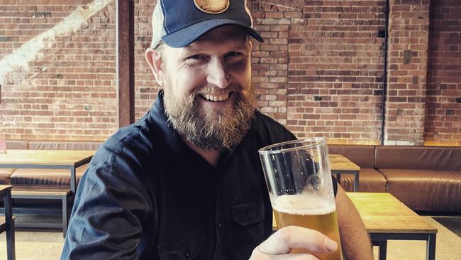 Headricks Lane brewer Alex Taubet with a glass of the speciality beer.