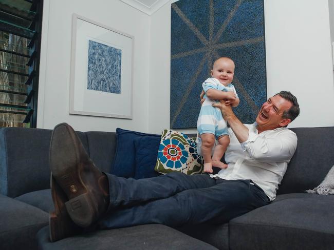 Chief Minister Michael Gunner celebrates with son Hudson, a win in the 2020 election , allowing Labor to govern in its own right. Picture GLENN CAMPBELL