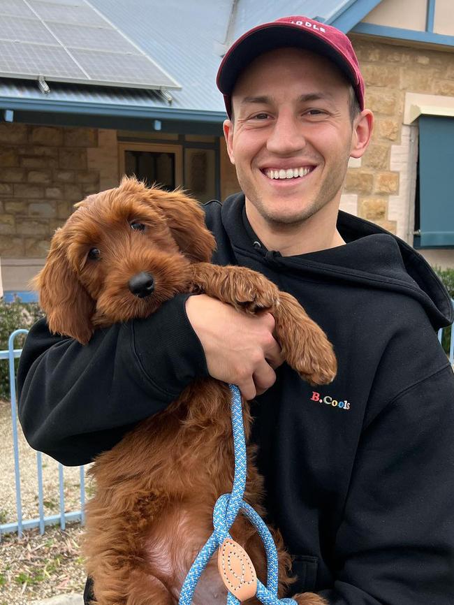 Crows player Tom Doedee with his dog Lenny. Picture: Instagram