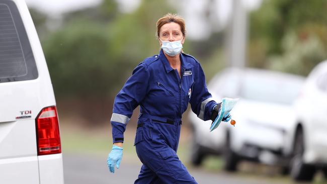 Police on site where a person was stabbed to death in Lara. Picture: Alison Wynd