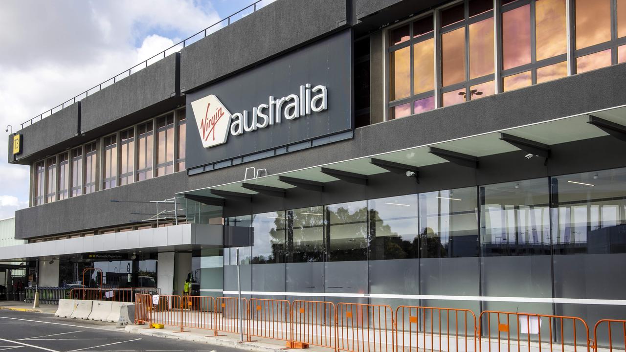 Two overseas passengers arrived at the Virgin Australia terminal at Melbourne Airport, after they were allowed to skip quarantine in New South Wales. Picture: Ian Currie