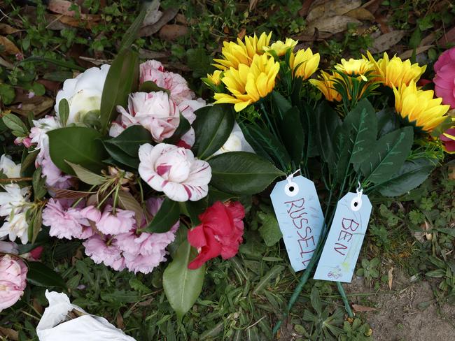 Floral and written tributes have been laid at the front of Our Lady of the Nativity Primary School where the brothers went to school. Picture: Richard Dobson