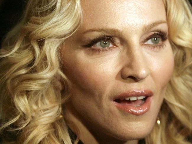 WIRE: US pop icon Madonna poses on the red carpet as she arrives for the premiere of the film she directed "Filth and Wisdom? and presented in the "Panorama Special" category at the 58th International Berlinale Film Festival on February 13, 2008 in Berlin. Madonna unveiled her directorial debut about starving artists in London at the international film festival, saying their hunger for stardom reminded her of her own dreams of fame 25 years ago.