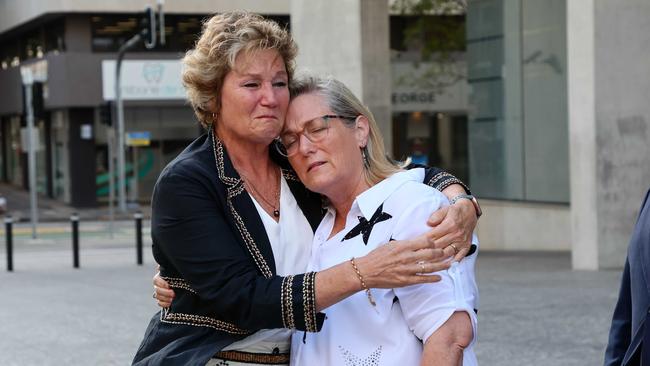 Bernie, the mother of Lachlan Griffiths, right, is comforted by a friend following the sentencing on Monday. Picture: NewsWire/Tertius Pickard