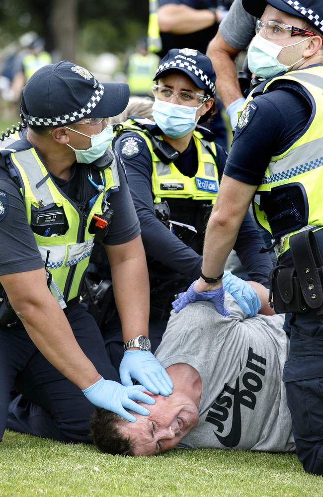 MELBOURNE, AUSTRALIA - NewsWire Photos FEBRUARY 20, 2021: Police arrest a man at Melbourne’s anti-vaccine protest. Picture: NCA NewsWire / David Geraghty