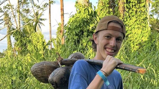 Alex Yurkiv collecting coconuts on a missions trip to Fiji where he loved to be able to share his music and his faith.