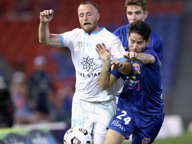 NEWCASTLE, AUSTRALIA - MAY 08:  Connor O'Toole of the Jets contests the ball against Rhyan Grant of Sydney FC during the A-League match between Newcastle Jets and Sydney FC at McDonald Jones Stadium, on May 08, 2021, in Newcastle, Australia. (Photo by Ashley Feder/Getty Images)