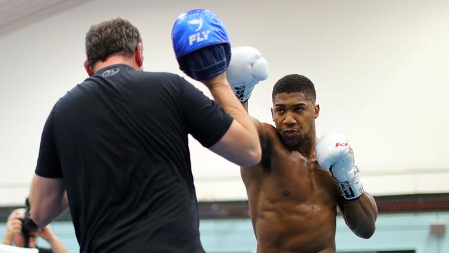 Anthony Joshua works out with his trainer Rob McCracken. (Photo by Richard Heathcote/Getty Images)