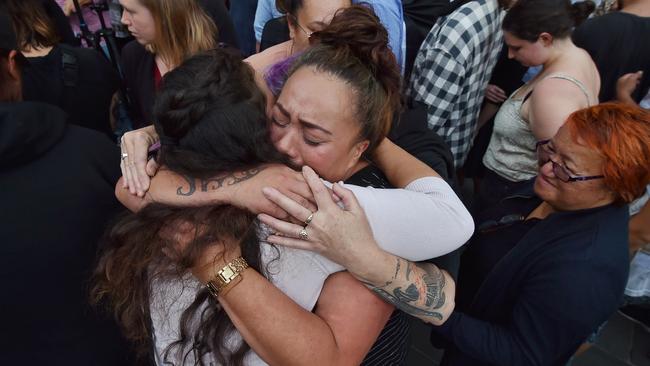 Two women comfort each other at a vigil for victims of the Christchurch massacre in front of Melbourne’s State Library. Picture: Jason Edwards