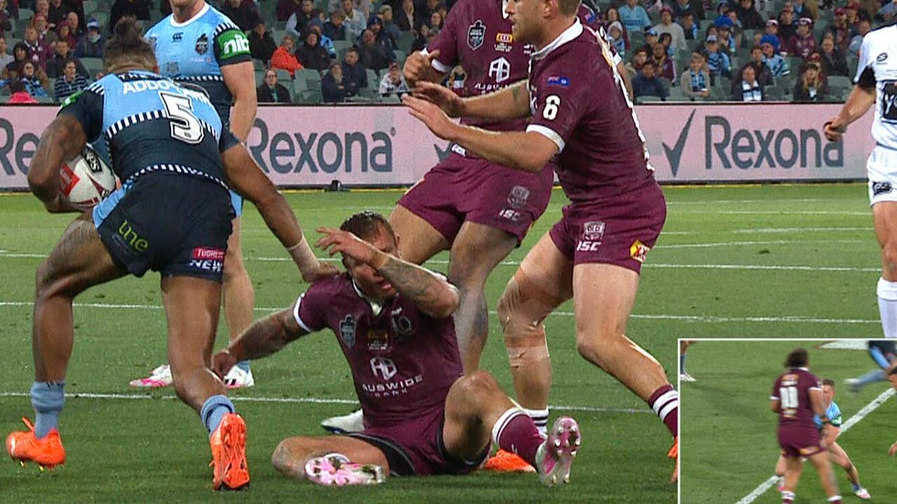 Jake Friend takes a heavy knock in a tackle.