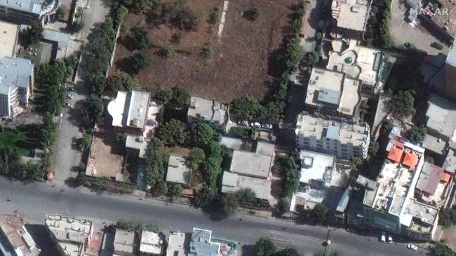 The building, left, last October 13, where Ayman al-Zawahiri was when killed by a drone strike on Sunay morning. Picture: Maxar Technologies via AFP