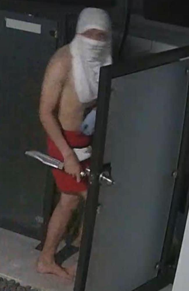 A man carrying a large hunting knife caught on CCTV in Broadbeach Waters. Picture: Supplied