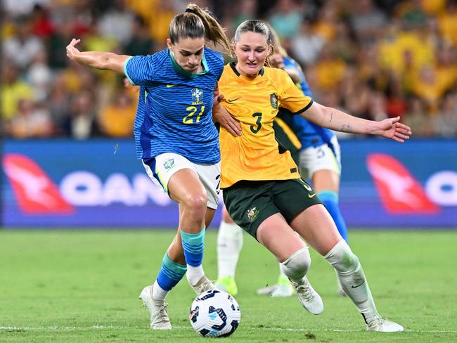 Giovana Queiroz of Brazil battles for possession with Winonah Heatley of Australia during the International Friendly match between the Matildas and Brazil at Suncorp Stadium on November 28, 2024 in Brisbane, Australia. (Photo by Bradley Kanaris/Getty Images)