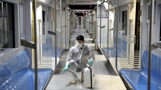 A worker disinfects subway trains against coronavirus in Tehran, Iran.