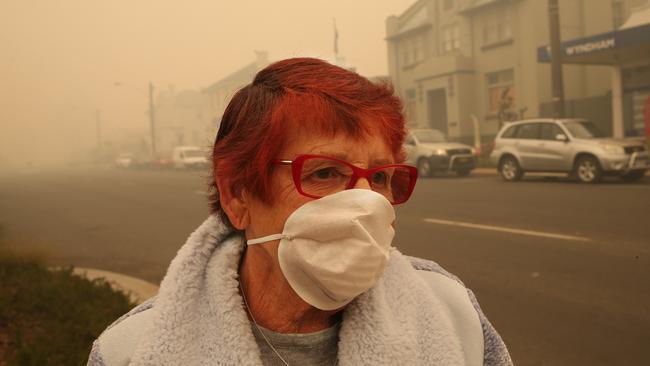 Anna McCarthy wears a mask for protection. Picture: David Crosling