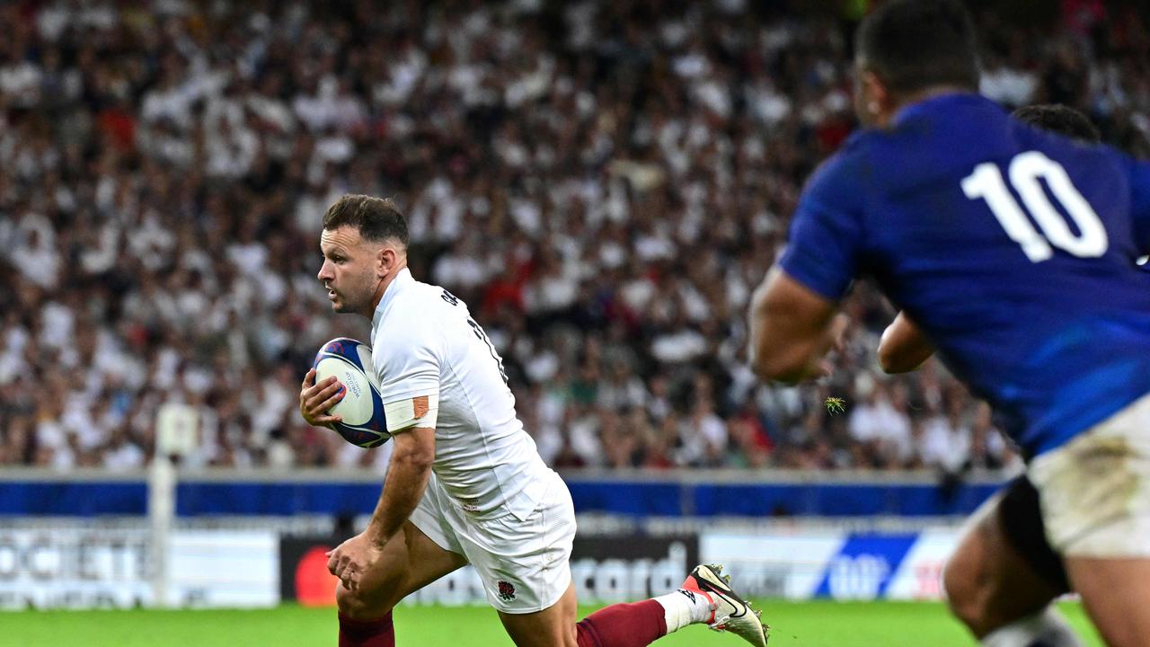 England’s scrum-half Danny Care runs on his way to scoring a try. (Photo by Miguel MEDINA / AFP)