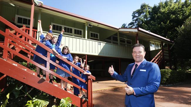 Tamborine Mountain State School Principal Jason Smith celebrates with students after the school was named Primary School of the Year. Picture: Mike Batterham.