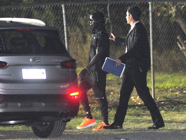 A man speaks with police at the scene. Picture: John Gass