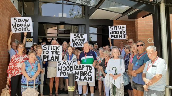 Residents gather outside of the Moreton Bay Regional Council Strathpine office ahead of council voting on Traders in Purple's development application for 2 and 8 Gayundah Esplanade, Woody Point. Photo Erin Smith