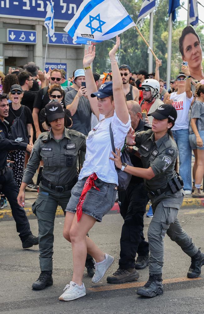 Police officers detain a protester as families and supporters of Israeli hostages held by Palestinian militants in the Gaza Strip since October hold a rally calling for their release in Tel Aviv. Picture: AFP