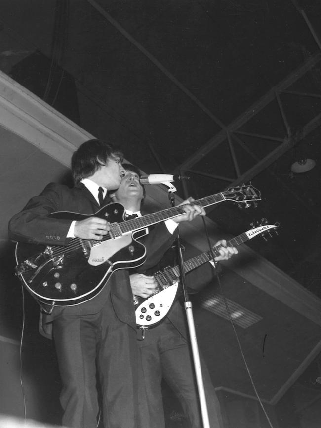 George Harrison and John Lennon perform at Festival Hall in Melbourne.