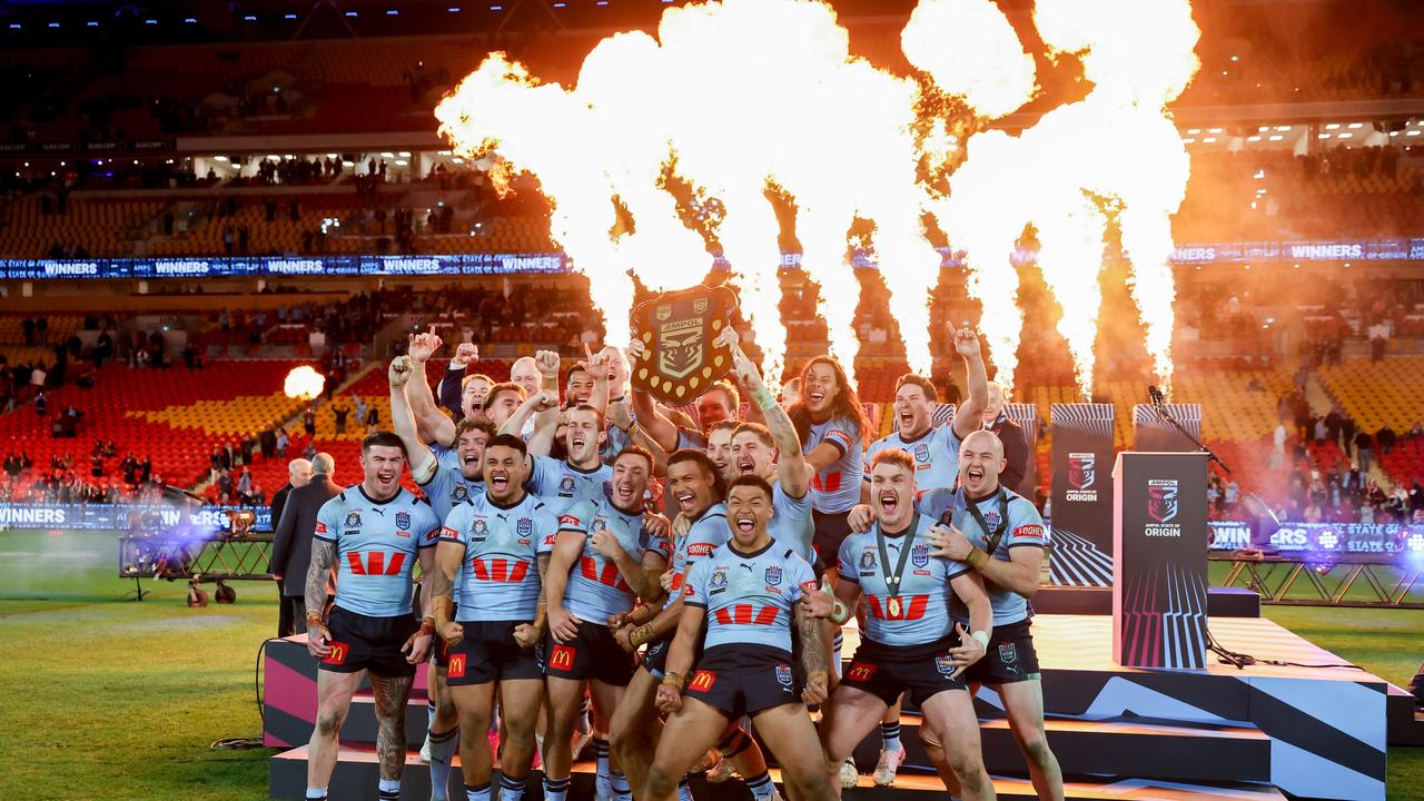 The NSW Blues celebrate after winning game 3 of the State of Origin at Suncorp Stadium. Picture by Luke Marsden.