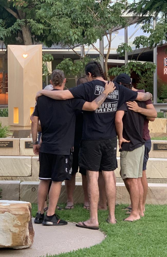 The Moranbah Miners’ Memorial is a special place in Moranbah built to commemorate those who have died in the coal mining industry. Pictured are workmates of miner Gavin Feltwell, who tragically died in a lifting incident at the Moranbah North underground mine on March 25. Picture: Duncan Evans