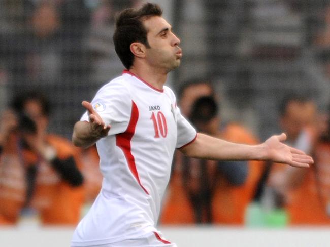 AMMAN, JORDAN - MARCH 26: Ahmed Hayel of Jordan celebrates kicking a goal during the FIFA World Cup Asian qualifier match between Jordan and Japan at King Abdullah International Stadium on March 26, 2013 in Amman, Jordan. (Photo by Kaz Photography/Getty Images)