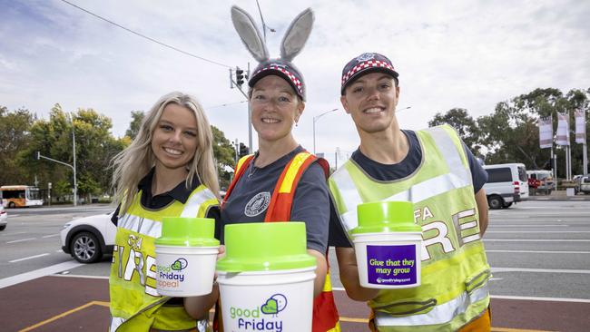 Tin rattlers Brooke Elliott, Louise Naus and Sam Nettleton from Warrandyte and Warandyte Sth CFA on Hoddle St, Richmond. Picture: Wayne Taylor