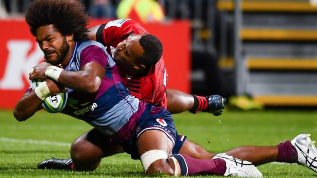 Henry Speightscores a try in the tackle of Manasa Mataele of the Crusaders.