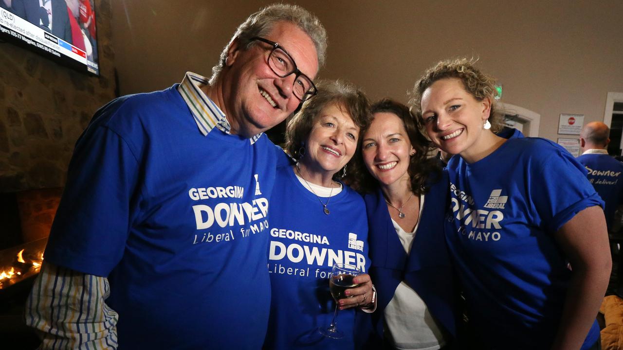 Then Liberal candidate Georgina Downer (second right) poses with father Alexander Downer (left), mother Nicky Downer and sister Henrietta (right) at the Barker Hotel, Adelaide, South Australia, Saturday, July 28, 2018. (AAP Image/Kelly Barnes)