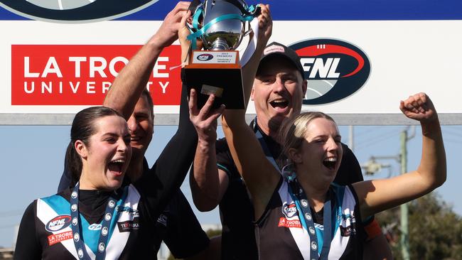 St Mary's coaches and captains lift the premiership trophy. Picture: Hamish Blair