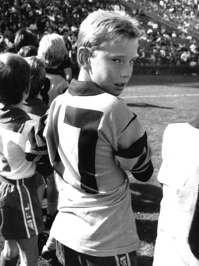 Shane Tuck, age 10, wears his dad Michael’s number during his Little League debut in March 1992