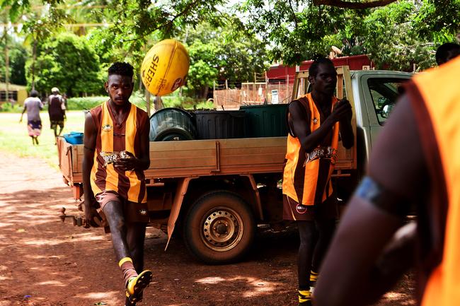 Tapalinga Superstars Brendon Kantilla warms up with his squad ahead of the grand final match against the Ranku Eagles on Sunday during this year's 49th Annual Tiwi Grand Final on Bathurst Island which is part of the Tiwi Islands chain, north of Darwin, NT. Picture: Justin Kennedy