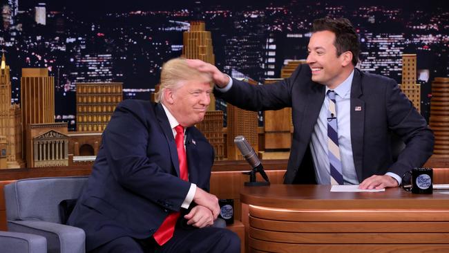 Yes, it’s real. Jimmy Fallon tests the hair of then Republican presidential candidate Donald Turmp in 2016 on the NBC Tonight Show. Fallon later said the subsequent row over whether he should have done that left him depressed. Picture: NBC/AFP