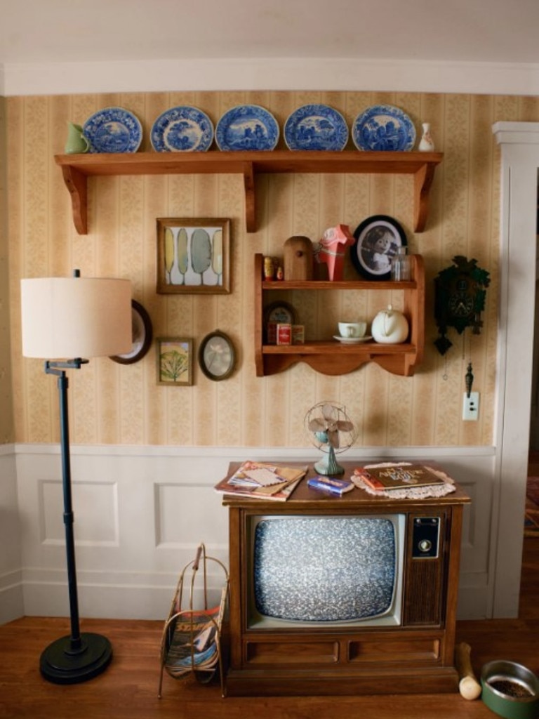 The old-style TV, with crockery lining the wall. Picture: Airbnb