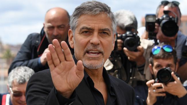 US actor George Clooney gestures on May 12, 2016 during a photocall for the film 