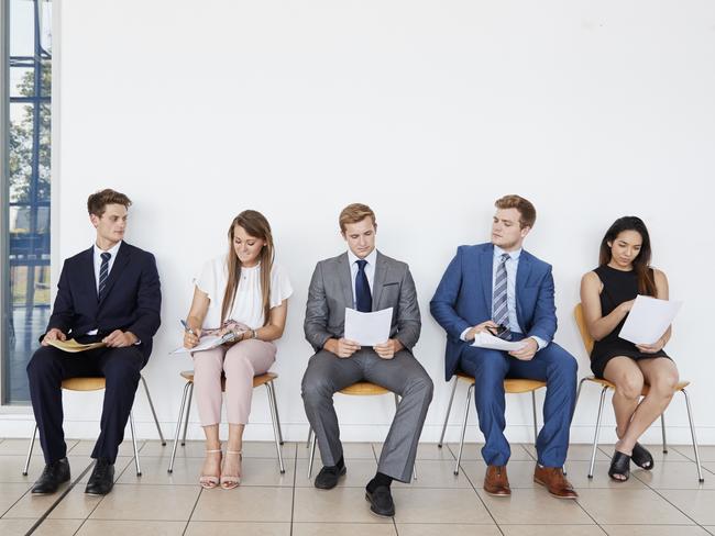 Candidates waiting for job interviews, full length, front. iStock