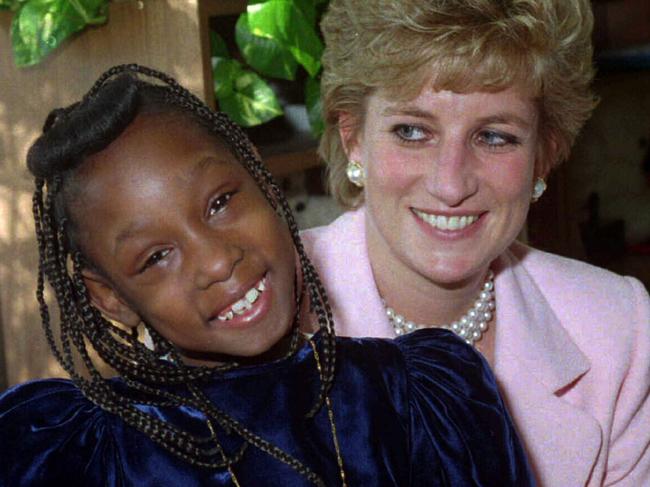 Diana, Princess of Wales, holds Monica, an outpatient at Harlem Hospital's pediatric department in New York. The two had met when Monica was an infant during the Princesses infamous visit in 1989.