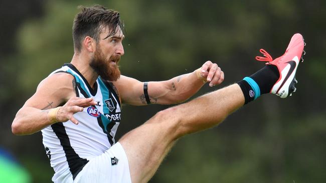 Charlie Dixon of the Power kicks a goal during the Marsh Community Series. Picture: AAP Image/Darren England